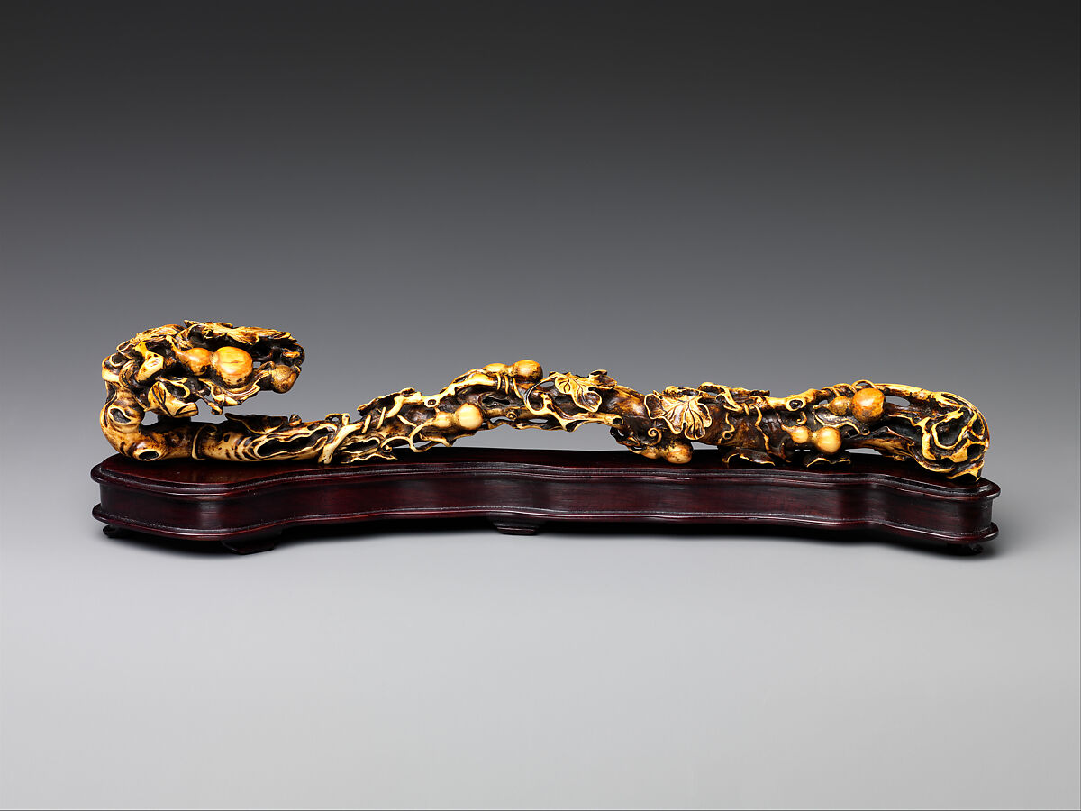 Used as a display item, this scepter takes the shape of a fungus known as a ruyi, a rebus for "as your wish."